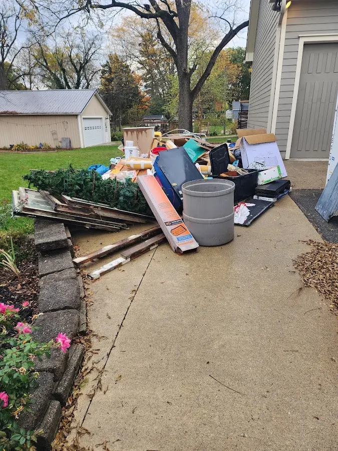 Dumpster being loaded with debris for Roofing Dumpster Rental in Perham